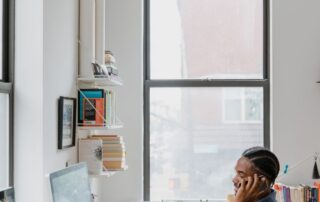 Adult practicing good posture and healthy movement at a desk in Mooresville, NC