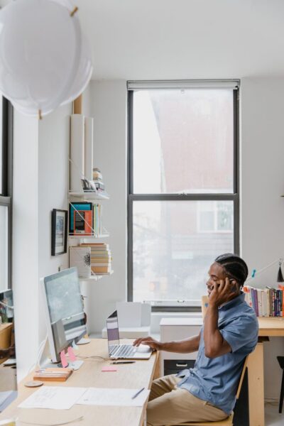 Adult practicing good posture and healthy movement at a desk in Mooresville, NC