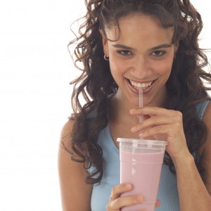 Young Woman Drinking Smoothie