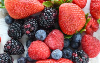 flavonoid-rich foods for happiness including berries and citrus