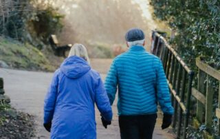 Couple walking outdoors in Mooresville NC for better health