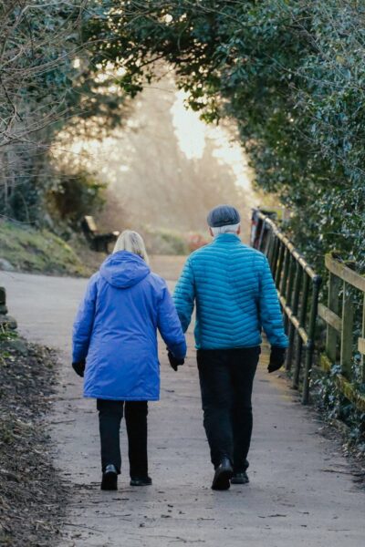 Couple walking outdoors in Mooresville NC for better health