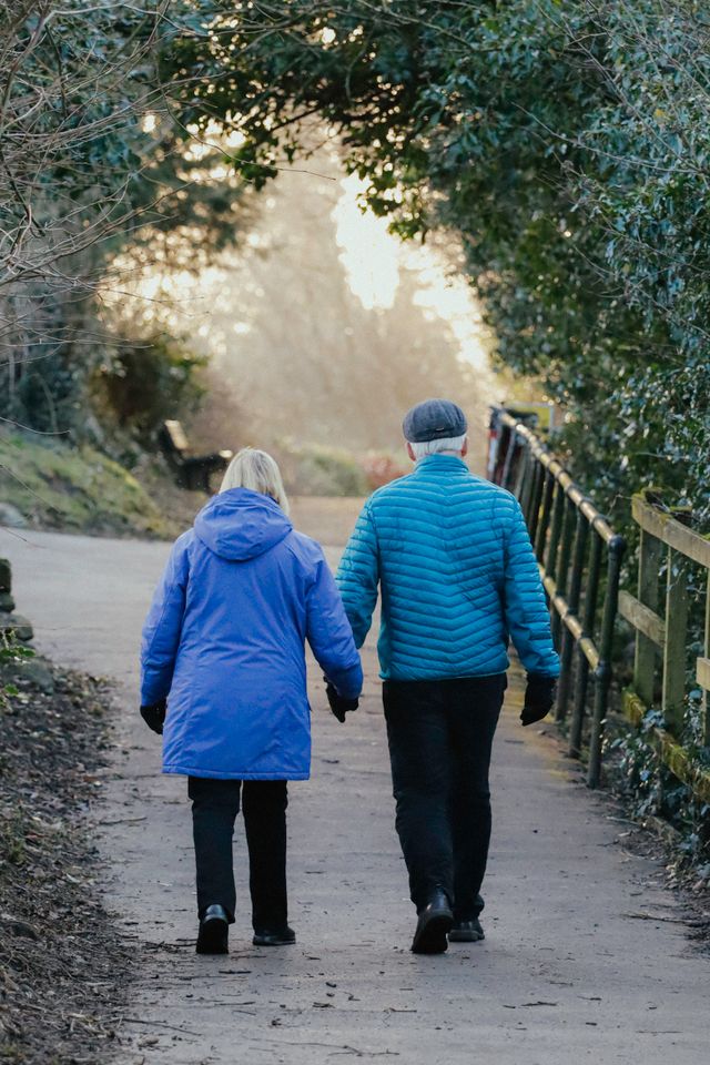 Couple walking outdoors in Mooresville NC for better health
